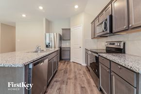 Fate house for rent - A kitchen with a FirstKey Homes logo.