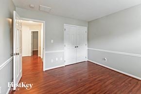 Greensboro house for rent - a bedroom with a hard wood floor and white doors