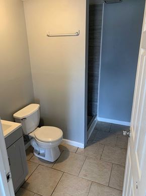 Barberton apartment for rent - a bathroom with a toilet and a shower
