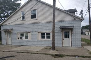 Barberton apartment for rent - a white house with a white door and windows