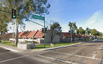 Glendale apartment for rent - a street corner with a green traffic light and some buildings