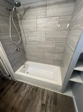 Akron apartment for rent - A modern bathroom with a walk-in shower and a white bathtub.