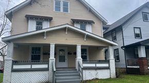 Akron apartment for rent - a house with a porch and a white fence