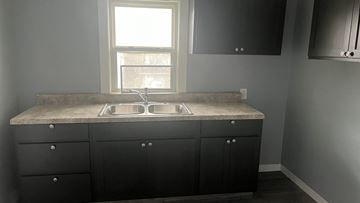 Akron apartment for rent - a kitchen with a sink and a window