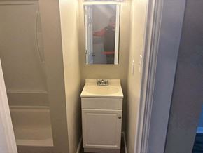 Akron apartment for rent - a small bathroom with a sink and a mirror