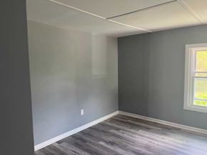 Akron apartment for rent - A room with a window and a grey wall.
