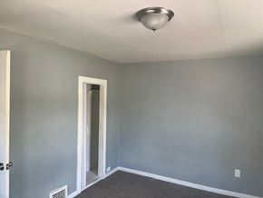 Akron apartment for rent - A room with a ceiling light and a door.