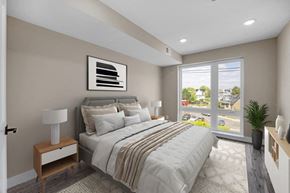 Washington apartment for rent - A bedroom with a large bed and a view of the outside.
