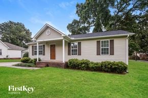 Kannapolis house for rent - A house with a brown door and two windows is for sale.