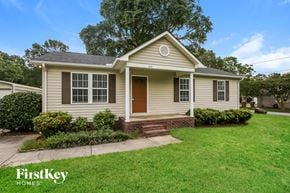 Kannapolis house for rent - A small house with a brown door and a window is for sale.