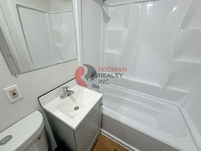 Longview apartment for rent - A white bathroom with a sink, toilet and bathtub.