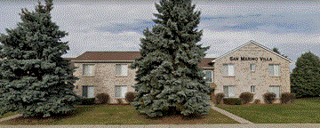 Sterling Heights apartment for rent - the front of a building with two large trees in front of it
