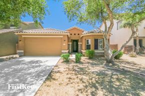 San Tan Valley house for rent - A house with a brown garage door is for sale.