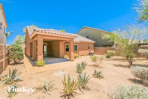 San Tan Valley house for rent - A desert-style home with a pool and a small garden.