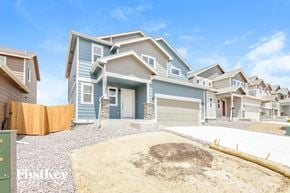 Colorado Springs house for rent - A row of houses with a blue sky in the background.