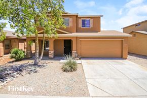 San Tan Valley house for rent - A house with a brown garage door is for sale.