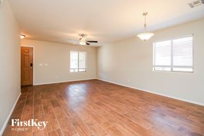 San Tan Valley house for rent - A room with wooden flooring and a ceiling fan.