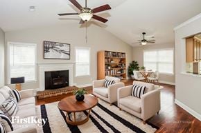 Midland house for rent - A living room with a fireplace and a bookshelf.