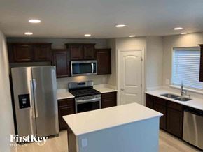 Colorado Springs house for rent - an updated kitchen with stainless steel appliances and white counter tops