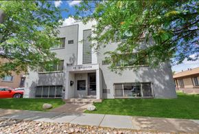 Denver apartment for rent - the front of a building with a sidewalk and grass