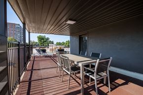 Denver apartment for rent - a patio with a table and chairs on a balcony