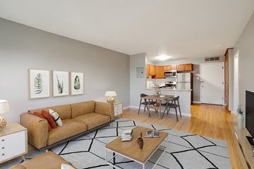 Denver apartment for rent - a living room with a couch and a table