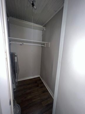 Hattiesburg apartment for rent - A small, empty room with a refrigerator and a wooden floor.