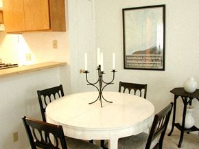 Santa Clarita apartment for rent - a dining room with a white table and chairs