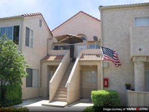 Santa Clarita apartment for rent - an flag flying in front of an apartment building