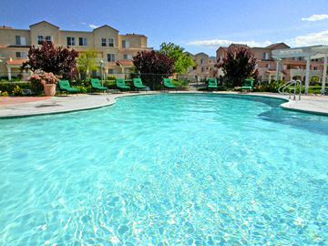 Santa Clarita apartment for rent - A large swimming pool in front of apartment buildings.