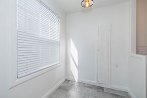 Oakland apartment for rent - A room with a white door and a window with blinds.