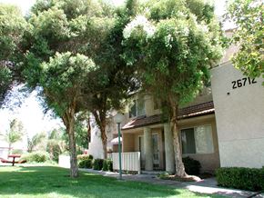 Santa Clarita apartment for rent - a building with a yard and trees in front of it
