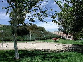Santa Clarita apartment for rent - a playground in a park with a picnic table