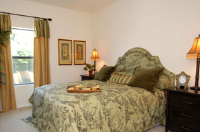 Los Angeles apartment for rent - A bedroom with a large bed and a window with curtains.