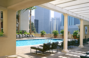 Los Angeles apartment for rent - A pool area with chairs and a table with a pool table in the middle.