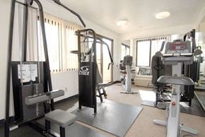 Los Angeles apartment for rent - a gym with weights and other equipment in a room with windows