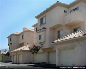 Santa Clarita townhouse for rent - a row of houses with white garage doors
