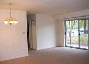 College Park apartment for rent - an empty living room with a sliding glass door