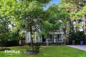 Fuquay Varina house for rent - a small white house with a tree in front of it