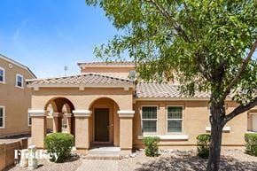Gilbert house for rent - a house with a tree in front of it