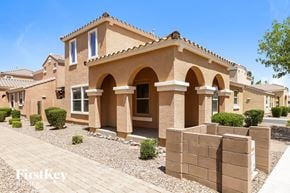 Gilbert house for rent - a house with a stone wall in front of it