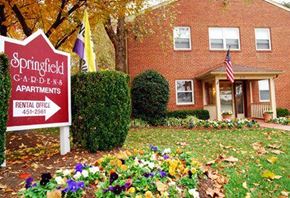 Springfield apartment for rent - a yard with a sign in front of a house