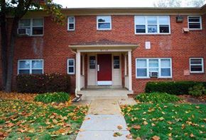 Springfield apartment for rent - a red brick house with a sidewalk in front of it