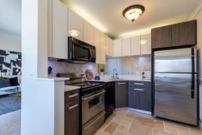 Novi apartment for rent - a kitchen with stainless steel appliances and a stainless steel refrigerator