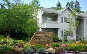 Spokane apartment for rent - A sign in front of a building that says Arthur Court Apartments.