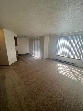 Spokane apartment for rent - an empty living room with a large window