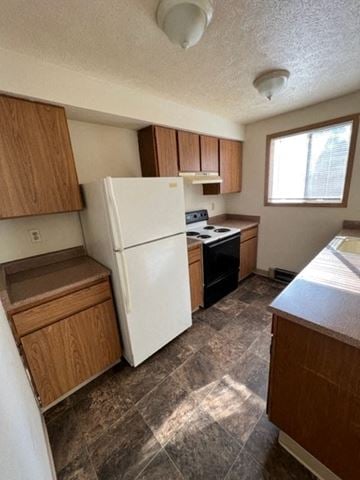 Spokane apartment for rent - a kitchen with a white refrigerator and a window
