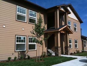 Medical Lake apartment for rent - A house with a brown siding and a white window.