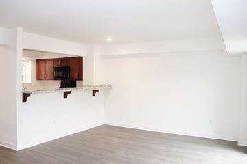 Sicklerville apartment for rent - an empty room with a kitchen and a counter top
