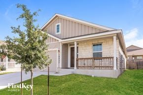 Converse house for rent - the front exterior of a house with a porch and a tree